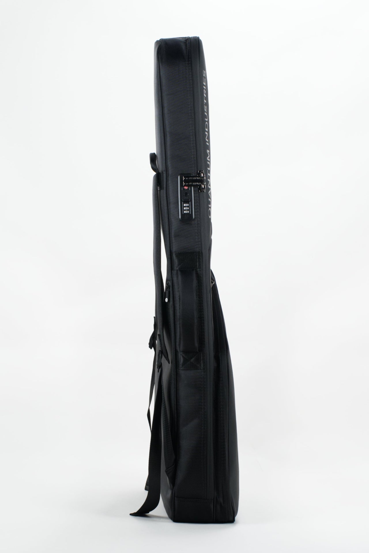 A black hard-shell guitar gig bag shown in profile against a clean white studio background.