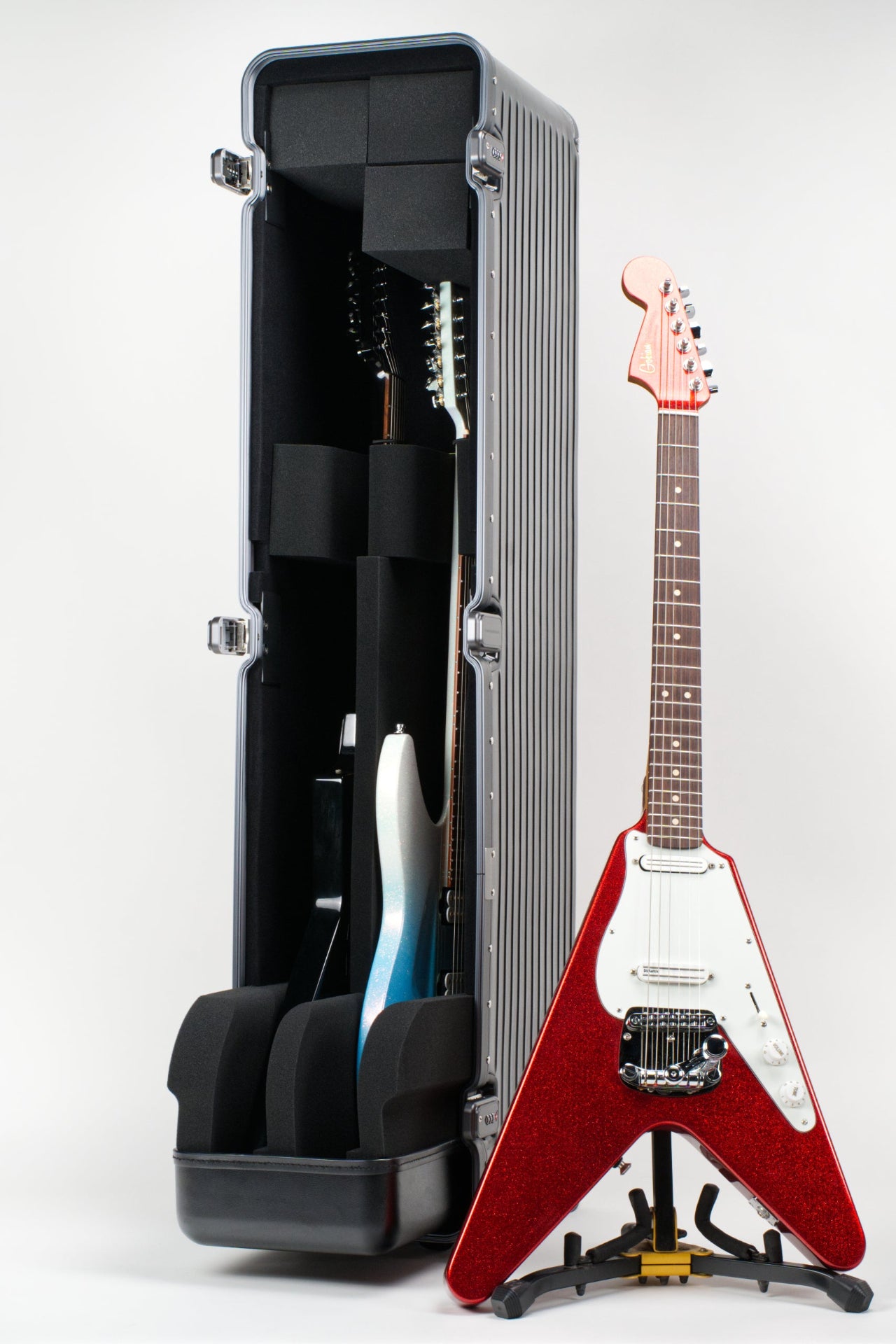 Gibson Flying V with a Gibson Explorer and Aristides 0/6 in our VXP Double Extreme Guitar Case