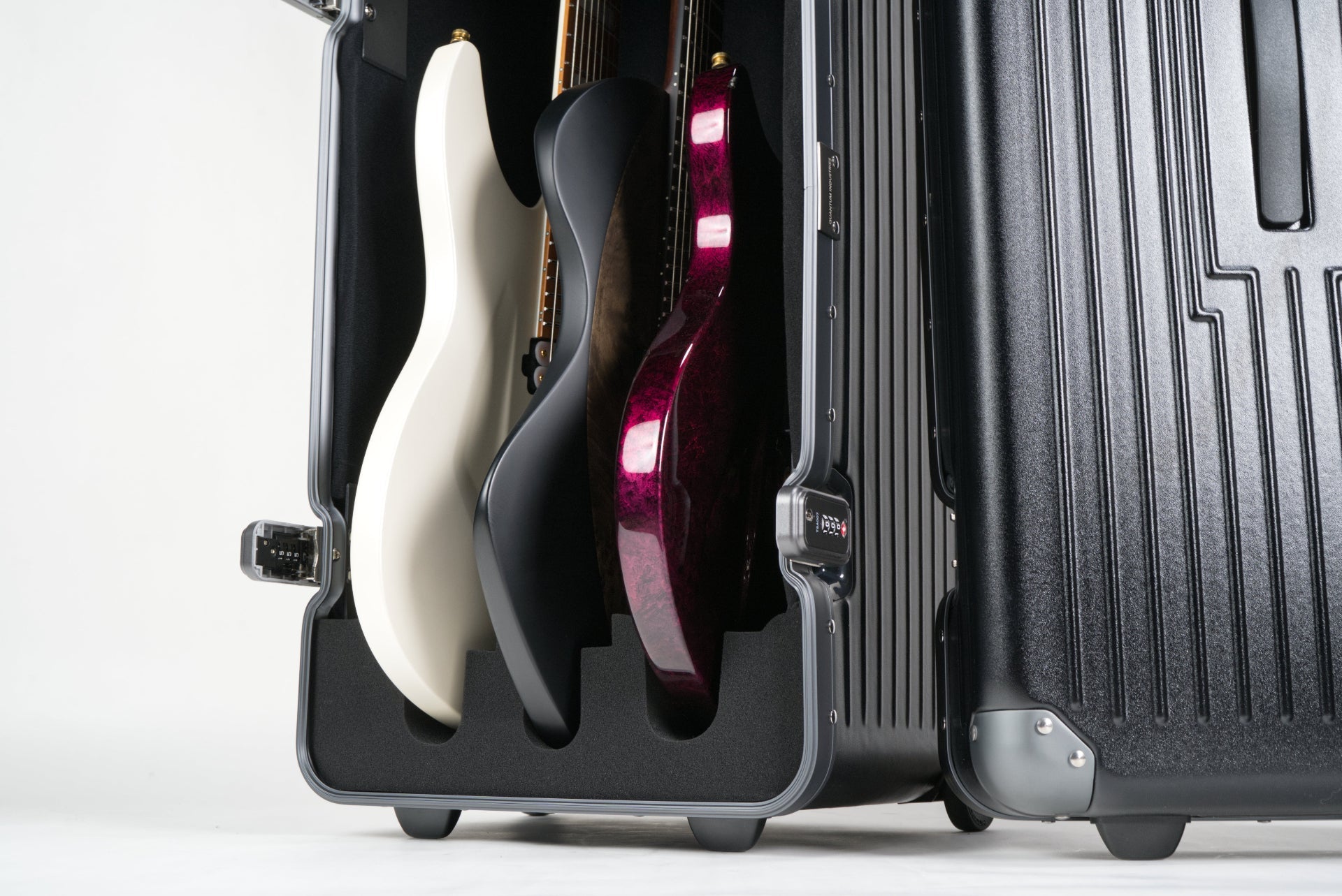GTX - Triple Guitar Case open showing how safe the guitars are resting in their foam spaces - QUANTUM INDUSTRIES